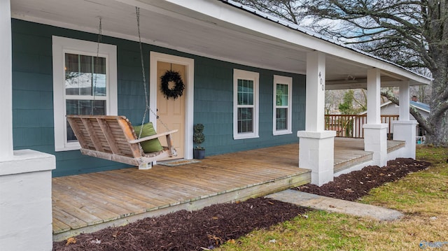 doorway to property with a porch