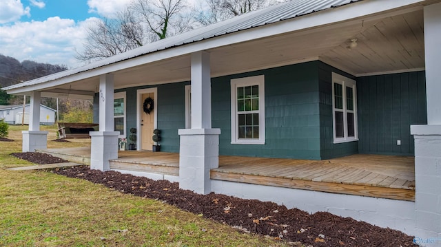 doorway to property with a porch