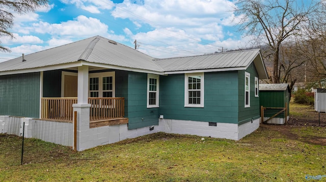 view of side of home featuring a yard