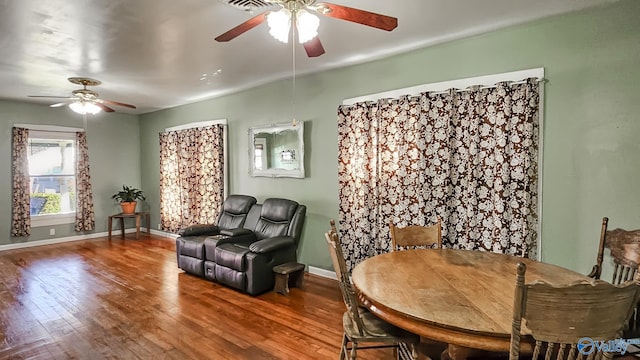 living area featuring ceiling fan and hardwood / wood-style floors