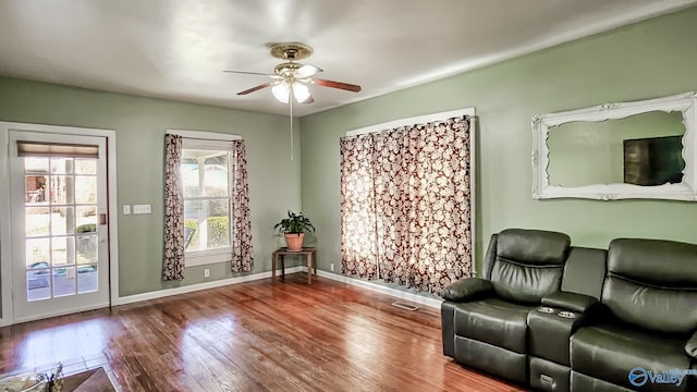 unfurnished room with ceiling fan and hardwood / wood-style flooring