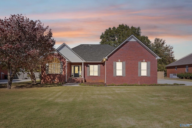 single story home with a yard