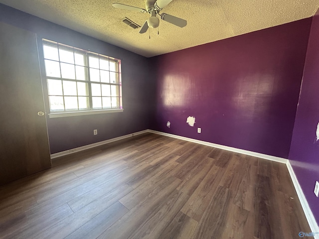 393 Canadian Dr, Scottsboro, AL 35769 - empty room featuring ceiling fan, a textured ceiling, visible vents, and wood finished floors