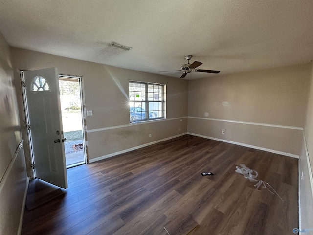 393 Canadian Dr, Scottsboro, AL 35769 - foyer featuring a textured ceiling, baseboards, dark wood-style flooring, ceiling fan, and visible vents