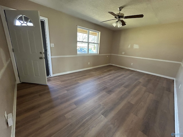 393 Canadian Dr, Scottsboro, AL 35769 - entryway featuring a textured ceiling, baseboards, ceiling fan, and dark wood-style floors
