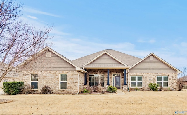 craftsman-style home with a front yard