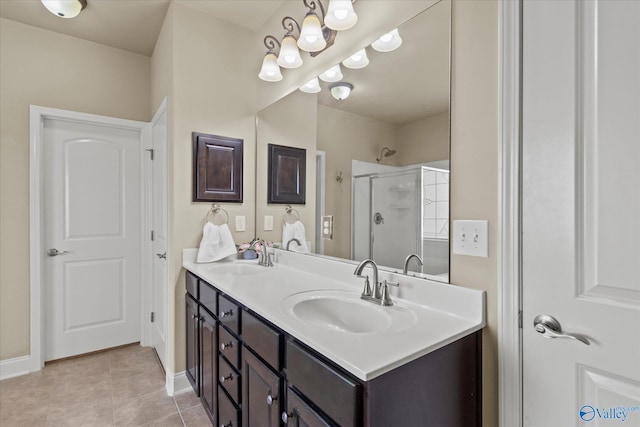 bathroom with tile patterned floors, vanity, and a shower with shower door