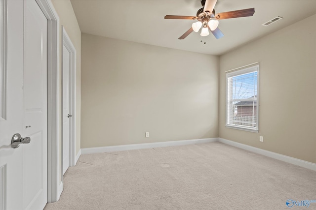 unfurnished bedroom with ceiling fan, a closet, and light carpet