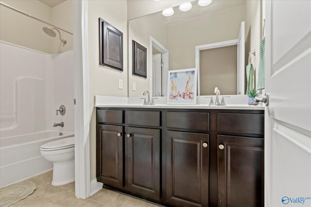 full bathroom with tile patterned flooring, vanity, toilet, and shower / washtub combination