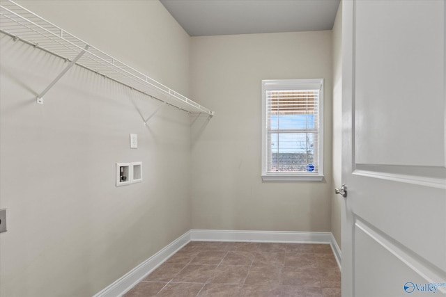 laundry area with light tile patterned floors and hookup for a washing machine