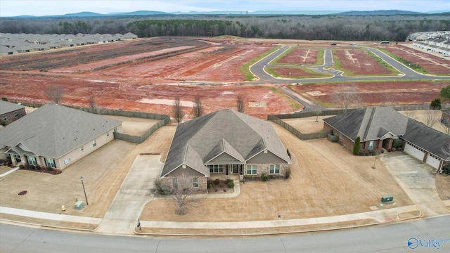 birds eye view of property with a mountain view