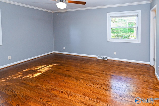 empty room with ornamental molding, dark hardwood / wood-style flooring, and ceiling fan