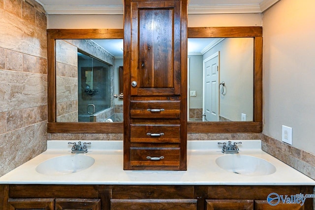 bathroom featuring ornamental molding and vanity