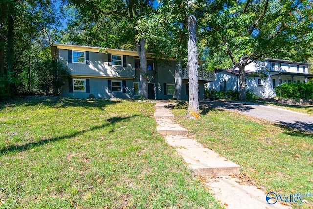 view of front of home with a front lawn