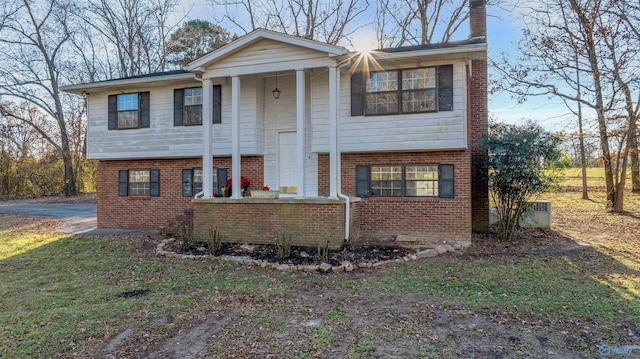 raised ranch featuring a front yard