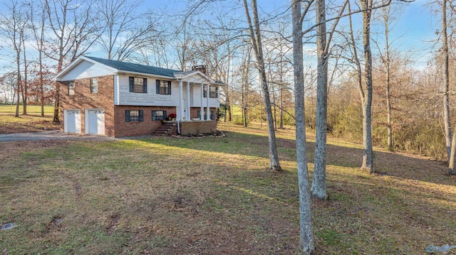 view of front facade with a front lawn and a garage