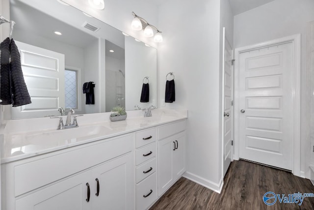 bathroom featuring hardwood / wood-style floors and vanity