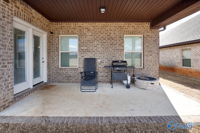 view of patio / terrace featuring a fire pit and area for grilling