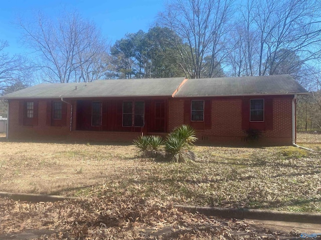 rear view of property featuring brick siding