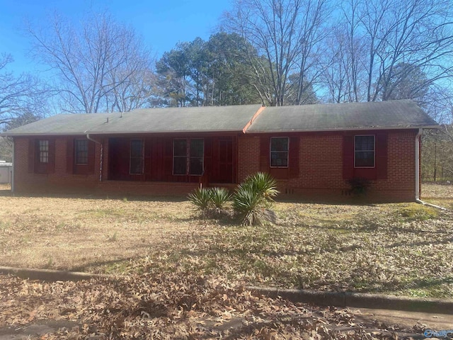 exterior space featuring brick siding