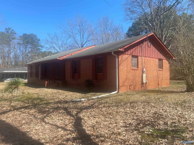 view of property exterior with brick siding