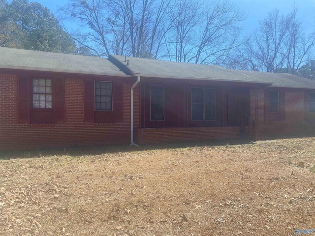 view of property exterior with brick siding