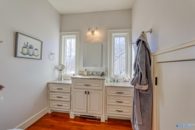 bathroom with vanity and hardwood / wood-style floors