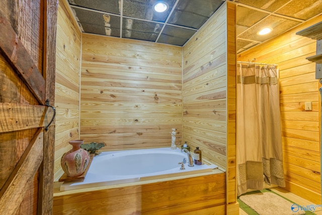 bathroom with separate shower and tub and wooden walls