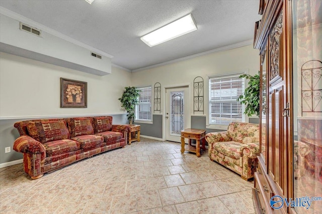 living room featuring a textured ceiling, plenty of natural light, visible vents, and crown molding