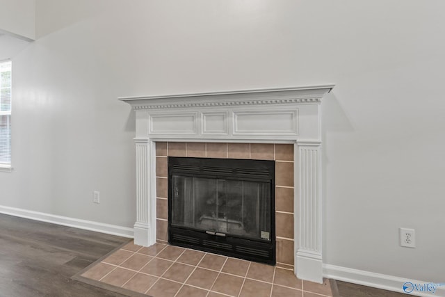 room details with hardwood / wood-style floors and a fireplace