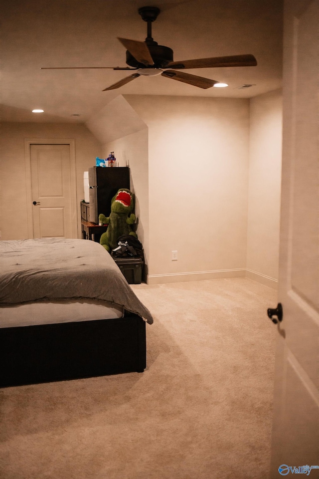 bedroom with carpet flooring, a ceiling fan, baseboards, and freestanding refrigerator