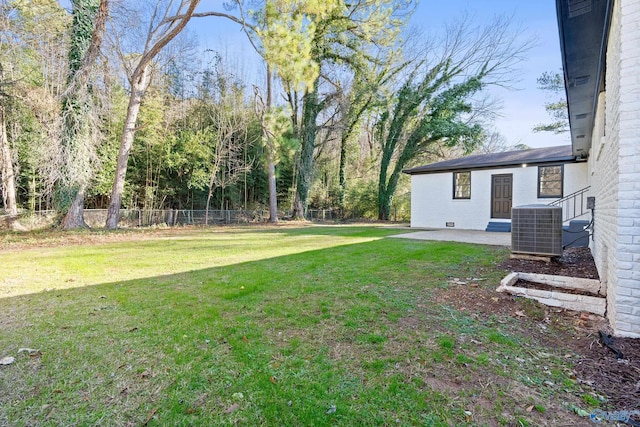 view of yard with a patio area and central AC