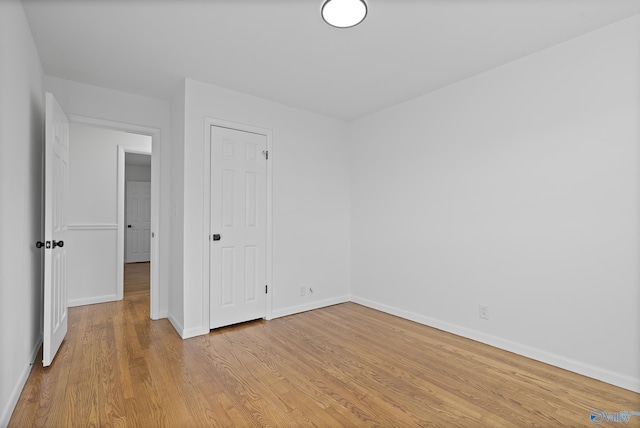 unfurnished bedroom with light wood-type flooring