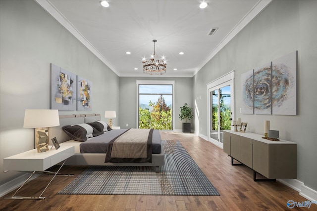 bedroom with hardwood / wood-style floors, a notable chandelier, ornamental molding, and access to outside