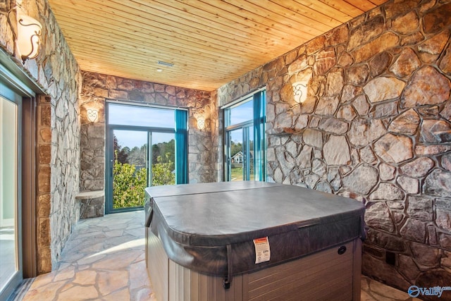 playroom with wood ceiling and a hot tub