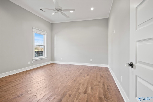 unfurnished room featuring hardwood / wood-style flooring, ceiling fan, and ornamental molding