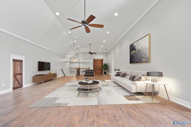 living room featuring light hardwood / wood-style floors, high vaulted ceiling, ceiling fan, and crown molding