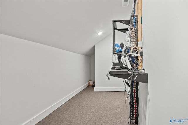 interior space featuring light carpet and lofted ceiling