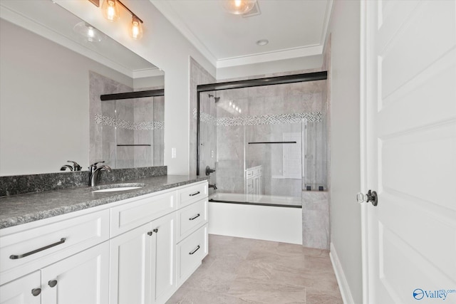 bathroom featuring shower / bath combination with glass door, crown molding, and vanity