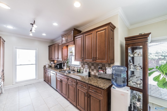 kitchen featuring dishwasher, ornamental molding, tasteful backsplash, and a sink