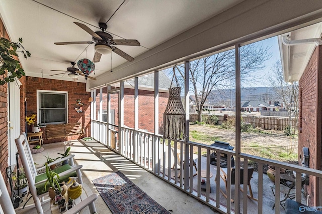 sunroom / solarium with ceiling fan