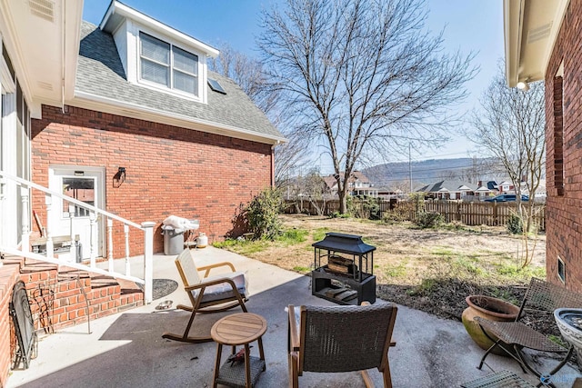 view of patio / terrace featuring entry steps and fence