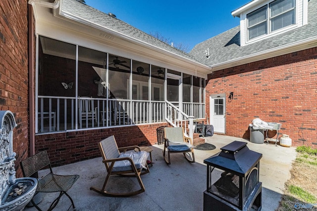 view of patio / terrace with a sunroom