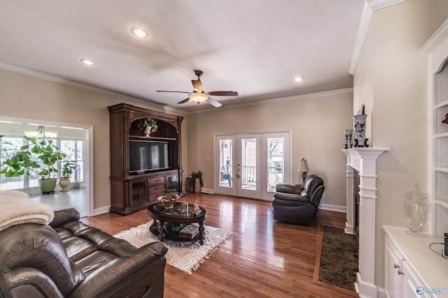 living area with french doors, baseboards, and wood finished floors