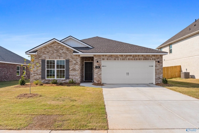 ranch-style house with fence, concrete driveway, a front yard, an attached garage, and brick siding