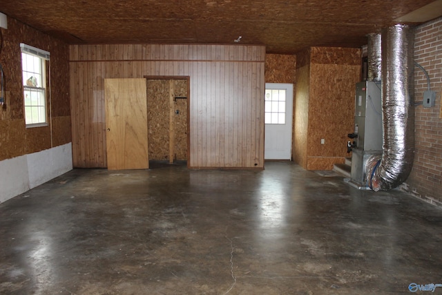 interior space featuring wooden walls