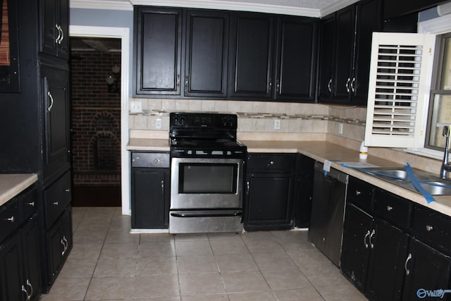 kitchen featuring stainless steel range with electric cooktop, dishwasher, crown molding, and light tile patterned floors