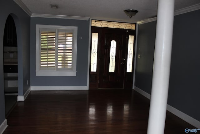 entryway with a textured ceiling, crown molding, and dark hardwood / wood-style flooring