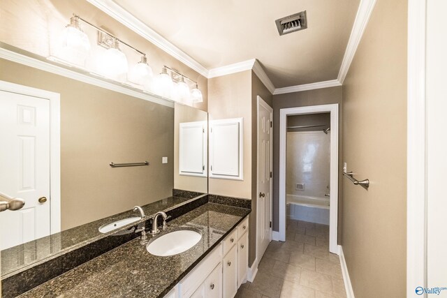 bathroom with tile patterned flooring, vanity, and ornamental molding