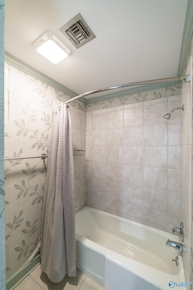 bathroom featuring tile patterned floors and shower / bath combo